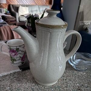 This is a Crown Manor "Desert Winds" stoneware coffee pot.